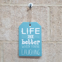 Load image into Gallery viewer, This uplifting Life Is Better When You Are Laughing ceramic plaque serves as a daily reminder to find joy in the moments. Hang it in your home as a humorous and positive addition to your decor, or gift it to a loved one in need of a smile.