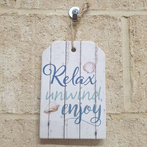 Display this beautifully crafted ceramic beach sign in any room to remind yourself to relax, unwind, and enjoy life. Its small size makes it perfect for hanging on walls &amp; doors. Let the peaceful ocean vibes wash over you with this charming novelty sign.
