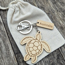 Load image into Gallery viewer, Elevate your keychain game with our sustainably made turtle Wooden Keychain! Show your love for Australia - both its incredible wildlife and locally-made products. Each keychain is expertly crafted with sustainable materials, making it the perfect eco-friendly gift for yourself or a fellow tourist.