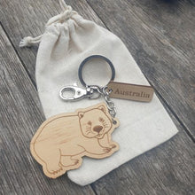 Load image into Gallery viewer, Elevate your keychain game with our sustainably made wombat Wooden Keychain! Show your love for Australia - both its incredible wildlife and locally-made products. Each keychain is expertly crafted with sustainable materials, making it the perfect eco-friendly gift for yourself or a fellow tourist.