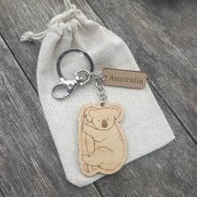 Load image into Gallery viewer, Elevate your keychain game with our sustainably made koala Wooden Keychain! Show your love for Australia - both its incredible wildlife and locally-made products. Each keychain is expertly crafted with sustainable materials, making it the perfect eco-friendly gift for yourself or a fellow tourist.