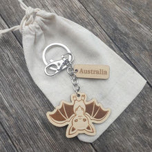 Load image into Gallery viewer, Elevate your keychain game with our sustainably made bat Wooden Keychain! Show your love for Australia - both its incredible wildlife and locally-made products. Each keychain is expertly crafted with sustainable materials, making it the perfect eco-friendly gift for yourself or a fellow tourist.