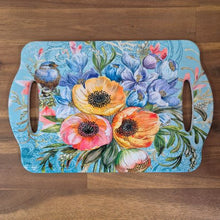 Load image into Gallery viewer, Expertly crafted garden serving tray with a beautiful blue bird design. This ceramic table tray features two hand grips for easy carrying and serving. Perfect for adding a touch of nature to your kitchen or dining table. Functional and decorative, it&#39;s a must-have for any bird or flower lover.  Ceramic | 28 x 18 cm | Gloss finish | Cork non slip backing | Two hand grips