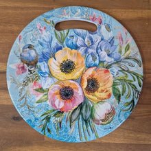 Load image into Gallery viewer, Protect your table and add a touch of nature with our Garden Flower Blue Bird Kitchen Trivet. Made of ceramic, this trivet features a beautiful blue bird and garden image, providing a functional and decorative addition to your kitchen. Keep your table safe while adding a touch of beauty.  Round | Ceramic | Gloss finish | Cork non slip backing | Diameter 20 cm | Design available in coasters &amp; serving tray.