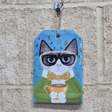 Load image into Gallery viewer, This ceramic hanging sign features a cute coffee-loving cat, making it the perfect gift for any cat lover. The small size is perfect for easy display and adds a touch of whimsy to any room. A must-have for any cat enthusiast.