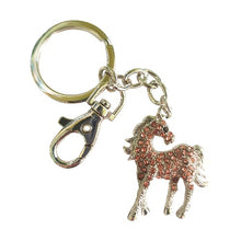 Load image into Gallery viewer, This high-quality horse foal keychain is the perfect accessory for any horse lover. Adorned with pink and silver rhinestones, it adds a touch of elegance to any keyring or bag chain. The sturdy clip and ring ensure lasting durability and make it a great gift option.