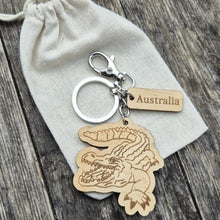 Load image into Gallery viewer, Elevate your keychain game with our sustainably made crocodile Wooden Keychain! Show your love for Australia - both its incredible wildlife and locally-made products. Each keychain is expertly crafted with sustainable materials, making it the perfect eco-friendly gift for yourself or a fellow tourist.