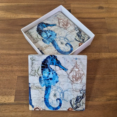 Protect your furniture and add a touch of seaside charm with our Seahorse Coasters. This set of 4 coasters features beautiful blue ocean seahorse designs, bringing a coastal feel to any room. Made to protect your surfaces, these coasters are a functional and stylish addition to your decor.