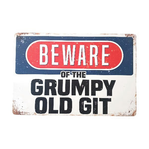 Introducing our Funny Metal Sign, perfect for adding humor to any space. Featuring the message "BEWARE Of The Grumpy Old Git", this sign is a funny gift for any grumpy person in your life. With its witty and playful design, it's sure to bring a smile to anyone's face. Make someone's day with this grumpy gift.