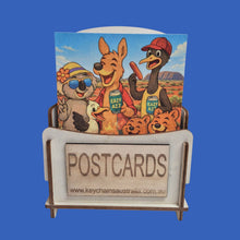 Load image into Gallery viewer, Australiana Funny Postcard Display Stand | 96 Assorted Cartoon Australiana Postcards | Small Wooden Display Stand