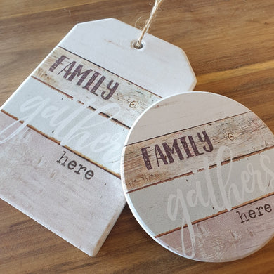 Family gathers here 1 x hanging plaque and coasters set box of 4.  Coasters - 10 cm diameter - Ceramic - Cork backing - Set of 4 - White gift box with lid  Hanging plaque - 10 x 15 cm + rope hanger - Ceramic - Cork backing - One Unit  A beautiful gift for any family home. View our whole shop today for more gift ideas - Keychains & Gifts Australia 