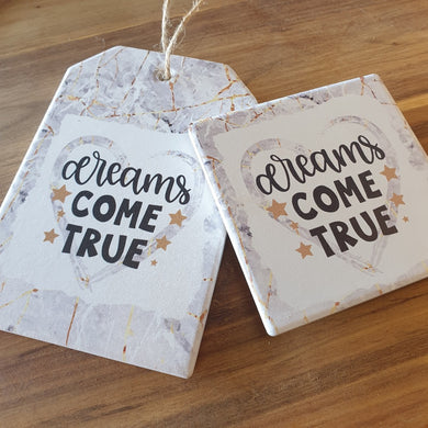 Dreams come true ceramic hanging plaque and matching design 4 set of ceramic boxed coasters.   A beautiful inspirational gift to give some one who's reaching for their dreams or even their dreams have come true.   Coaster diameter - 10cm - Ceramic - Set of four - Cork back - Boxed white gift box with lid  Hanging plaque - 10 x 15 cm plus rope hanger - Ceramic - Cork backing   View our whole shop today for more beautiful gifts - Keychains & Gifts Australia 