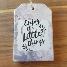 Load image into Gallery viewer, Enjoy The Little Things -  A Beautiful positive gift set of 1 x hanging plaque sign + 4 x ceramic coasters boxed.  Coasters - Diameter 10 cm - Ceramic - White gift box with lid - Cork backing - Set of 4   Hanging Plaque - 10 x 15 cm + rope hanger - Ceramic - Cork backing   It&#39;s always the little things in life that give us the most happiness.   View our whole shop today for more gift ideas - Keychains &amp; Gifts Australia