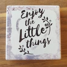 Load image into Gallery viewer, Enjoy The Little Things -  A Beautiful positive gift set of 1 x hanging plaque sign + 4 x ceramic coasters boxed.  Coasters - Diameter 10 cm - Ceramic - White gift box with lid - Cork backing - Set of 4   Hanging Plaque - 10 x 15 cm + rope hanger - Ceramic - Cork backing   It&#39;s always the little things in life that give us the most happiness.   View our whole shop today for more gift ideas - Keychains &amp; Gifts Australia