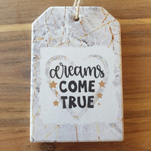 Load image into Gallery viewer, Dreams come true ceramic hanging plaque and matching design 4 set of ceramic boxed coasters.   A beautiful inspirational gift to give some one who&#39;s reaching for their dreams or even their dreams have come true.   Coaster diameter - 10cm - Ceramic - Set of four - Cork back - Boxed white gift box with lid  Hanging plaque - 10 x 15 cm plus rope hanger - Ceramic - Cork backing   View our whole shop today for more beautiful gifts - Keychains &amp; Gifts Australia 