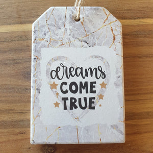 Dreams come true ceramic hanging plaque and matching design 4 set of ceramic boxed coasters.   A beautiful inspirational gift to give some one who's reaching for their dreams or even their dreams have come true.   Coaster diameter - 10cm - Ceramic - Set of four - Cork back - Boxed white gift box with lid  Hanging plaque - 10 x 15 cm plus rope hanger - Ceramic - Cork backing   View our whole shop today for more beautiful gifts - Keychains & Gifts Australia 