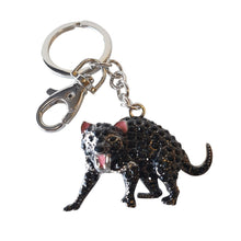 Load image into Gallery viewer, Our beautiful hand made Tasmanian Devil key / bag chain is a beautiful Australian gift to give.  The Australian Tasmanian Devil is a carnivorous marsupial from Tasmanian and loved all around the world.   6 x 10 cm - Silver keychain - Black Rhinestones - Hand painted - All key / bag chains come in a beautiful organza gift bag ( colours will vary )   View our full range of beautiful gifts - Keychains &amp; Gifts Australia. 
