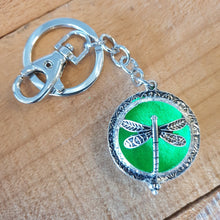 Load image into Gallery viewer, Dragonfly - Dragonfly Oil Diffusor Keyring - Bag Chain - Keychain Gift.  The Dragonfly symbolizes change, transformation, adaptability and self realization.   Add a few drops of your favourite essential oils to your Dragonfly keychain pad, and hang on your keys, bag in your car or office to have benefits of your oils around you.   Silver keychain - Double mini magnet closing - Green oil pads x 3 - Come in  Cotton Tribal gift bag - Keychain 3.5 x 12 cm  