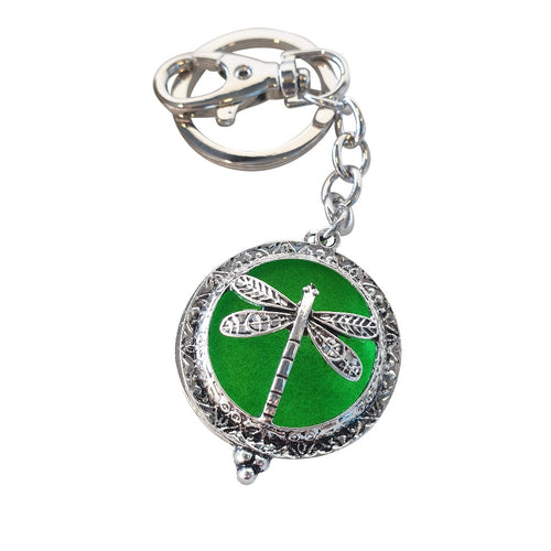 Dragonfly - Dragonfly Oil Diffusor Keyring - Bag Chain - Keychain Gift.  The Dragonfly symbolizes change, transformation, adaptability and self realization.   Add a few drops of your favourite essential oils to your Dragonfly keychain pad, and hang on your keys, bag in your car or office to have benefits of your oils around you.   Silver keychain - Double mini magnet closing - Green oil pads x 3 - Come in  Cotton Tribal gift bag - Keychain 3.5 x 12 cm  