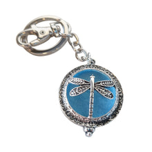 Load image into Gallery viewer, Dragonfly - Dragonfly Oil Diffusor Keyring - Bag Chain - Keychain Gift.  The Dragonfly symbolizes change, transformation, adaptability and self realization.   Add a few drops of your favourite essential oils to your Dragonfly keychain pad, and hang on your keys, bag in your car or office to have benefits of your oils around you.   Silver keychain - Double mini magnet closing - Light blue oil pads x 3 - Come in  Cotton Tribal gift bag - Keychain 3.5 x 12 cm 