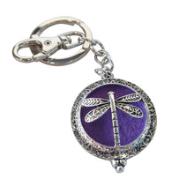 Load image into Gallery viewer, Dragonfly - Dragonfly Oil Diffusor Keyring - Bag Chain - Keychain Gift.  The Dragonfly symbolizes change, transformation, adaptability and self realization.   Add a few drops of your favourite essential oils to your Dragonfly keychain pad, and hang on your keys, bag in your car or office to have benefits of your oils around you.   Silver keychain - Double mini magnet closing - Purple oil pads x 3 - Come in  Cotton Tribal gift bag - Keychain 3.5 x 12 cm