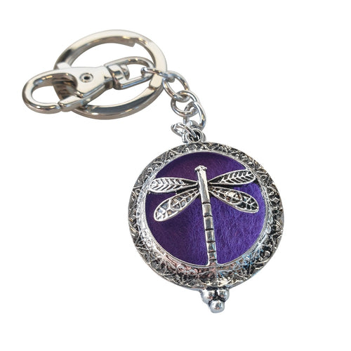 Dragonfly - Dragonfly Oil Diffusor Keyring - Bag Chain - Keychain Gift.  The Dragonfly symbolizes change, transformation, adaptability and self realization.   Add a few drops of your favourite essential oils to your Dragonfly keychain pad, and hang on your keys, bag in your car or office to have benefits of your oils around you.   Silver keychain - Double mini magnet closing - Purple oil pads x 3 - Come in  Cotton Tribal gift bag - Keychain 3.5 x 12 cm