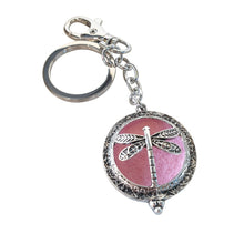 Load image into Gallery viewer, Dragonfly - Dragonfly Oil Diffusor Keyring - Bag Chain - Keychain Gift.  The Dragonfly symbolizes change, transformation, adaptability and self realization.   Add a few drops of your favourite essential oils to your Dragonfly keychain pad, and hang on your keys, bag in your car or office to have benefits of your oils around you.   Silver keychain - Double mini magnet closing - Light pink oil pads x 3 - Come in  Cotton Tribal gift bag - Keychain 3.5 x 12 cm 