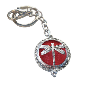 Dragonfly - Dragonfly Oil Diffusor Keyring - Bag Chain - Keychain Gift.  The Dragonfly symbolizes change, transformation, adaptability and self realization.   Add a few drops of your favourite essential oils to your Dragonfly keychain pad, and hang on your keys, bag in your car or office to have benefits of your oils around you.   Silver keychain - Double mini magnet closing - Red oil pads x 3 - Come in  Cotton Tribal gift bag - Keychain 3.5 x 12 cm 