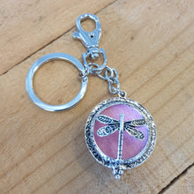 Load image into Gallery viewer, Dragonfly - Dragonfly Oil Diffusor Keyring - Bag Chain - Keychain Gift.  The Dragonfly symbolizes change, transformation, adaptability and self realization.   Add a few drops of your favourite essential oils to your Dragonfly keychain pad, and hang on your keys, bag in your car or office to have benefits of your oils around you.   Silver keychain - Double mini magnet closing - Light pink oil pads x 3 - Come in  Cotton Tribal gift bag - Keychain 3.5 x 12 cm 
