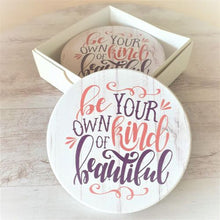 Load image into Gallery viewer, Introducing the perfect addition to any household - our &quot;Be Your Own Kind Of Beautiful&quot; table coasters! These coasters not only protect your tables from stains and scratches, but they also serve as a daily reminder to embrace your unique beauty. Comes as a set of 4 in a beautiful gift box.  Our beautiful,&nbsp; Be your own kind of beautiful coasters are the perfect uplifting gift for yourself or that special person in your life.