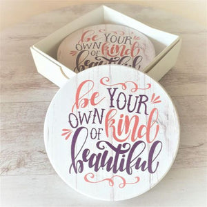 Introducing the perfect addition to any household - our "Be Your Own Kind Of Beautiful" table coasters! These coasters not only protect your tables from stains and scratches, but they also serve as a daily reminder to embrace your unique beauty. Comes as a set of 4 in a beautiful gift box.  Our beautiful,&nbsp; Be your own kind of beautiful coasters are the perfect uplifting gift for yourself or that special person in your life.