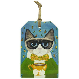 Our very popular coffee cat, now come's in a hanging ceramic plaque to finish your set of coffee cat collection.  Also available in coasters, kitchen trivet and magnets. View our full shop Keychains & Gifts Australia for more Purrrfect gifts.   10 x 15 cm + Rope hanger - Ceramic - Cork backing - Gloss finish  Cat gifts - Cat gift - Hanging cat sign - Cat people gifts - Cat lover Gifts