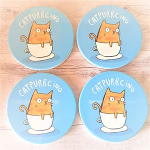 Our adorable funny Catpurrcino cat coasters are the purrrfect cat lovers gift.  Boxed set of 4 same design | Blue | Ceramic | Cork backing | Diameter 10cm.  Design also available in kitchen trivet & magnet | View our shop for the purrrfect gift - Keychains & Gifts Australia.
