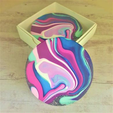 These stunning , very colourful coasters will brighten up any bar, kitchen, coffee table or dining table area.  Our beautiful coaster sets are the perfect gift, to give.   Quality ceramic | Round | Diameter 10 cm | White gift box with lid | Cork non slip backing | Matt finish | Set of 4 same design  View our full range of beautiful gif