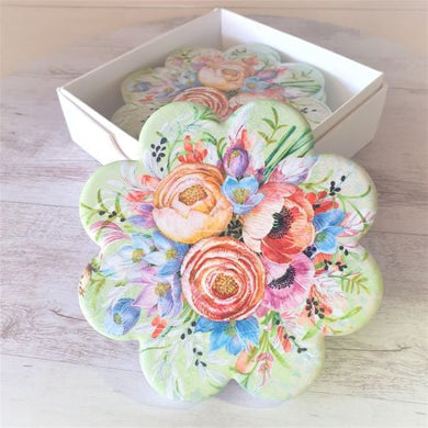 Our beautiful coasters are the perfect gifts to brighten up any table, kitchen or bar area.   These stunning garden flower coasters are the perfect gifts.  Quality ceramic | Flower shaped | Diameter 11 cm | White gift box with lid | Set of 4 same design | Pattern and colours as shown in photo | Glossy finish | Cork non slip backing