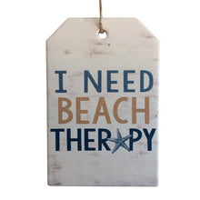 Load image into Gallery viewer, Our very popular I Need Beach Therapy range is the perfect gift for anyone who love&#39;s the water, the surf and the sand.   This very popular design is also available in Surf Board Plaque, hanging plaque, hanging sign, magnet &amp; coasters.  10 x 15 cm - Colour as shown in photo - Rope hanger - Ceramic - Cork backing - View our full shop for more item&#39;s in this beautiful design. Keychains &amp; Gifts Australia - Beach gift - ocean gift - beach therapy gift 