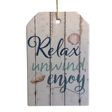 Load image into Gallery viewer, Relax Unwind Enjoy Germanic hanging plaque sign 10 x 15 cm - Rope hanger - Ceramic - Cork backing - Ocean themed gift- Colours as shown in photo.   Great gift for any household. We all need a little Relax, Unwind and Enjoy.  view our store today for more beautiful gifts - Keychains &amp; Gifts Australia.  Beach gift - Beach sign - Relax unwind gift - Hanging beach sign