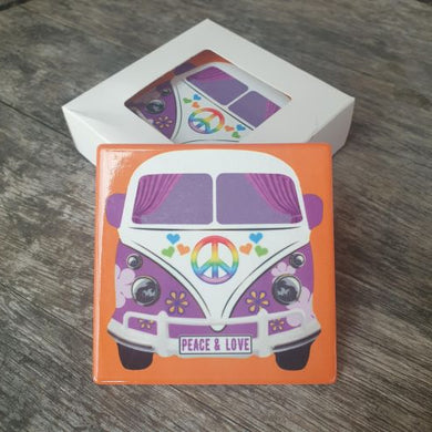 These Kombi VW Coasters are a must-have for any kombi fan. With a cool design that features the iconic Kombi with peace and love number plates, these coasters provide both functional protection for your surfaces and a decorative touch to your home. Complete with a boxed set of 4, these coasters make the perfect gift.  Peace & Love Kombi square coasters | Set of 4 same design | 10 x 10 cm | Cork backing | Gloss finish | Ceramic | Cork non slip backing | White gift box with lid | Orange back ground