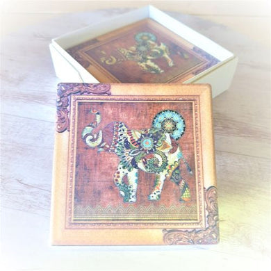 Enhance your home decor with these Lucky Elephant Coasters. Made of high-quality ceramic, they provide a stylish and functional way to protect your furniture from drink stains. Each set includes 4 coasters, each featuring a beautiful and symbolic lucky elephant design. Perfect for gifting with its elegant gift box.  Quality ceramic | Square | Matt Finish | Design and colours as shown in photo | Set of 4 same design | 10 x 10 cm | White gift box with lid.