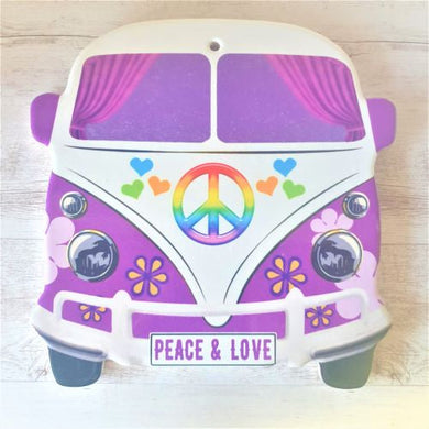 Our stunning bright split screen Kombi kitchen trivets have multiple uses.  * Protect your kitchen benches from hot pots and pans as a trivet  * Small serving tray / coaster  * Hang as a decorative sign plaque. Your Kombi has a hole ready to hang.  Quality ceramic | Kombi shaped | 20 x 20 cm | Cork non slip backing | Purple & white | Glossy finish | Bright fun quirky peace and love print and colours.