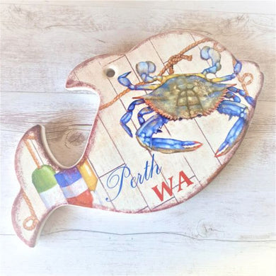 Experience the beauty of Western Australia with our Dolphin Crab Trivet. Made from durable material, this kitchen trivet features a unique dolphin shape from the city of Perth. Protect your countertops while adding a touch of charm to your kitchen. A must-have for tourists and local residents alike.  Quality ceramic | Dolphin shaped | Kitchen trivet | Hanging sign with hole | Cork non slip backing | Length 23.5 cm | Height 14 cm | Beautiful bright colours as shown | Perth WA writing.
