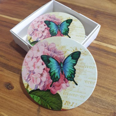 These Butterfly Pink Flower Blue Butterfly Coasters are the perfect addition to your home decor. Made of durable ceramic, this set of four coasters features a beautiful butterfly design that adds a touch of elegance to any room. Protect your tables while adding a decorative touch with this boxed gift set.