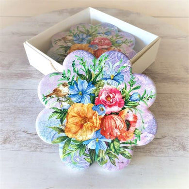 Our beautiful coasters are the perfect gifts to brighten up any table, kitchen or bar area.   These stunning garden bird coasters are the perfect gifts.  Quality ceramic | Flower shaped | Diameter 11 cm | White gift box with lid | Set of 4 same design | Pattern and colours as shown in photo | Glossy finish | Cork non slip backing