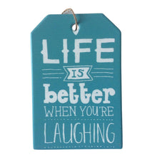 Load image into Gallery viewer, ife is better when you are laughing, hanging plaque sign. Brighten up someone&#39;s day with a reminder that laughter is the best medicine.  10 x 15 cm - Ceramic - Cork backing - Rope hanger - Blue &amp; white as shown in photo.   View our shop for more beautiful gifts - Keychains &amp; Gifts Australia   Laughing gift - Laughing sign - Laughing giftware - Life is better gift.