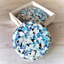 Load image into Gallery viewer, Our beautiful coasters are the perfect gift to give. Brighten up any table, kitchen or bar area with these blue mosaic coasters.  Textured sides - as shown in photo | Round | Blue mosaic image / print | Glossy finish | Diameter 11 cm | White gift box with lid | Set of 4 same design.  View our full range of gifts, we have something for everyone - Keychains &amp; Gifts Australia. 