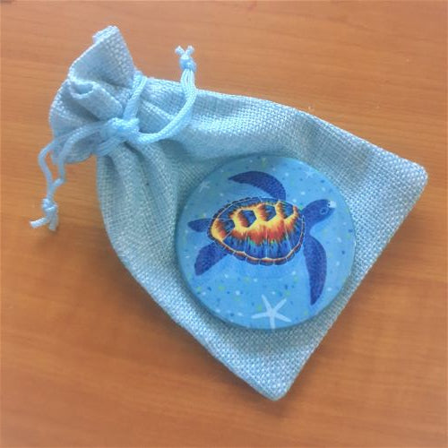This Turtle Blue Ocean Fridge Magnet is the perfect gift for any ocean lover. Made with high-quality materials, this magnet features a charming turtle design that will add a touch of marine life to any fridge or magnetic surface. Show off your love for turtles with this unique and functional gift.