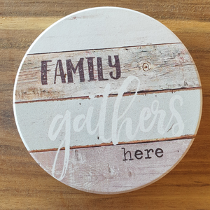 Family gathers here 1 x hanging plaque and coasters set box of 4.  Coasters - 10 cm diameter - Ceramic - Cork backing - Set of 4 - White gift box with lid  Hanging plaque - 10 x 15 cm + rope hanger - Ceramic - Cork backing - One Unit  A beautiful gift for any family home. View our whole shop today for more gift ideas - Keychains & Gifts Australia 