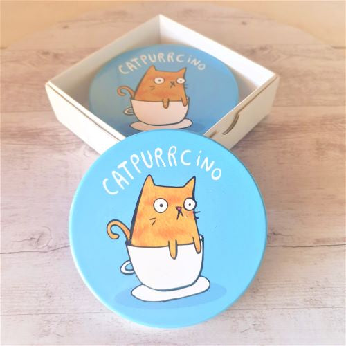Our adorable funny Catpurrcino cat coasters are the purrrfect cat lovers gift.  Boxed set of 4 same design | Blue | Ceramic | Cork backing | Diameter 10cm.  Design also available in kitchen trivet & magnet | View our shop for the purrrfect gift - Keychains & Gifts Australia.