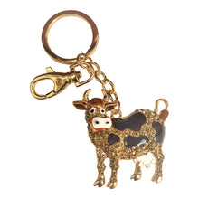 Load image into Gallery viewer, Our super adorable hand made cow keychain is the perfect gift for any cow lover.  Hand painted | Super cute | Silver rhinestones | Gold metal | Keychain full length 11.5 cm | Cow 5 x 5 cm | Chunky keyring - bag chain - keychain | Quality gift | Come&#39;s in a beautiful cotton organza gift bag - colour will vary.  View our full website, we have something for everyone | We wholesale all over Australia - contact us today. 