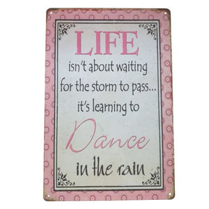 Elevate your home décor with this Dance In The Rain metal sign. Its beautiful design and meaningful message serve as a reminder to always find joy in life's challenges. Give it as an uplifting gift to a loved one, or keep it for yourself to inspire positivity in your own home.  Life isn't about waiting for the storm to pass it's about learning To Dance In The Rain.